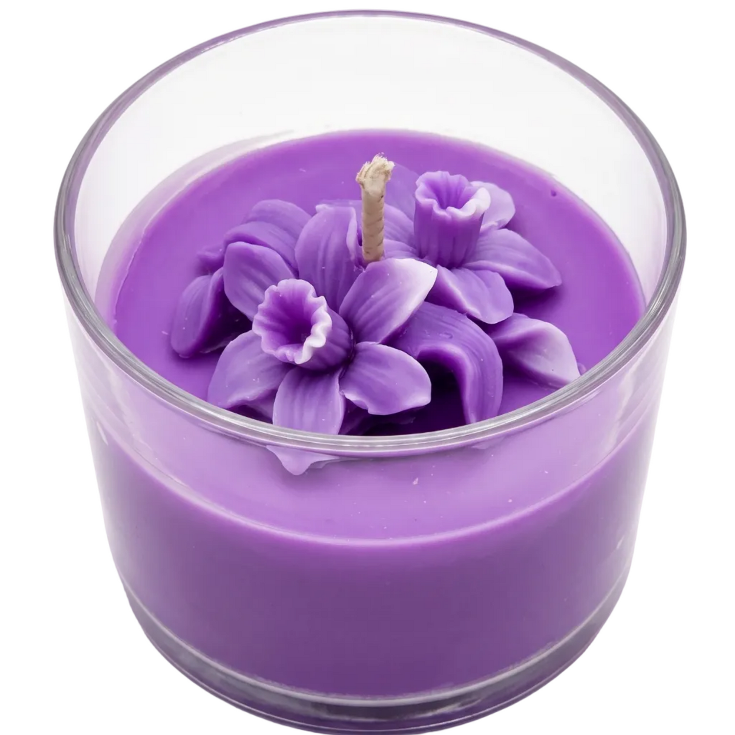 Purple candle with floral design in a glass container on a white background